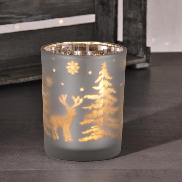 Glasvase mit weihnachtlichen Motiven und